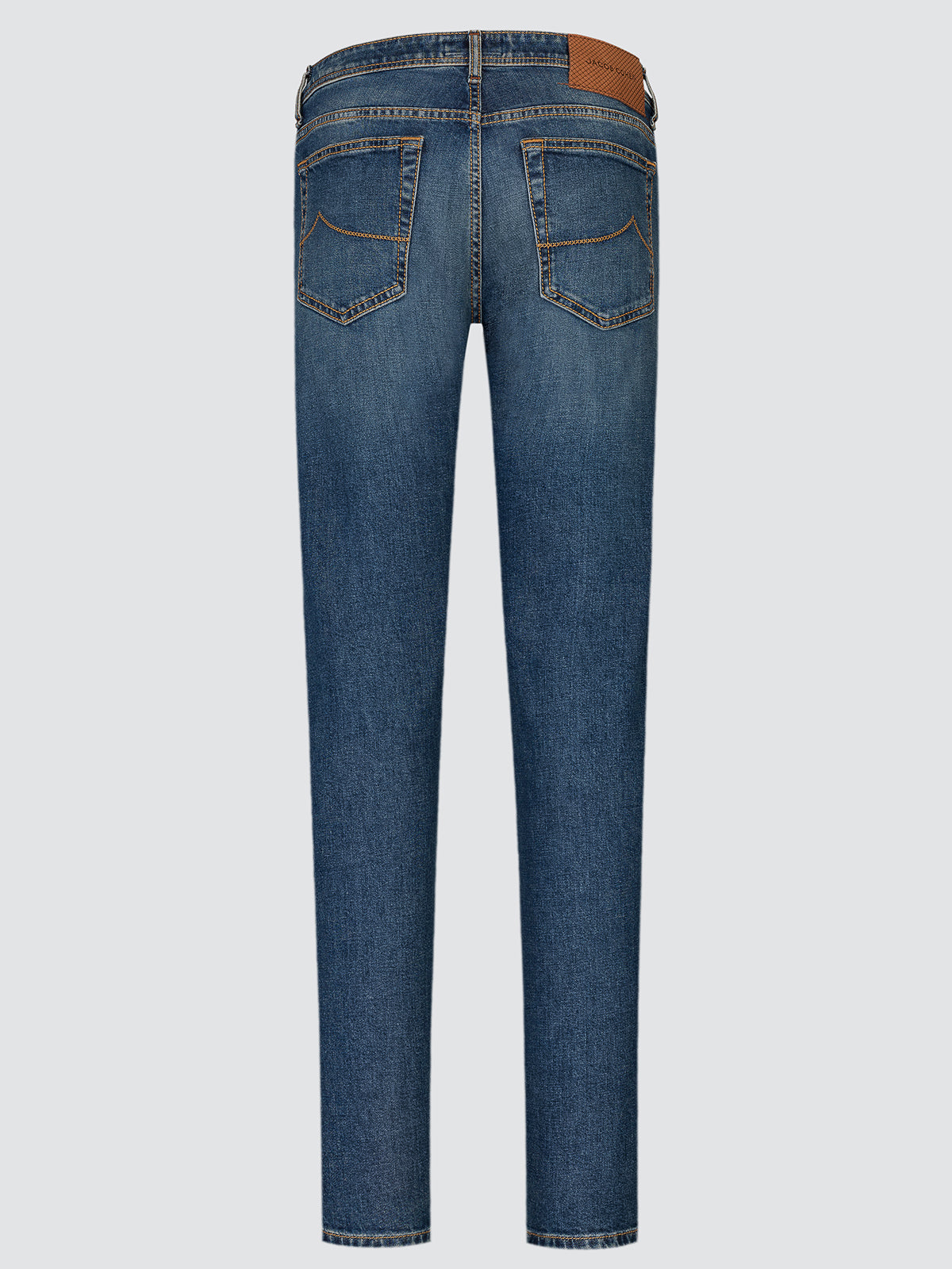 Full-length back view of medium blue Bard comfort jeans laid flat, showing both back pockets and the leather waistband patch.