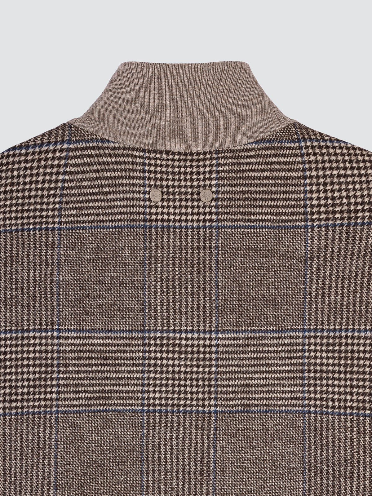 Flat close-up of the chest and stand collar of the Prince of Wales check bomber jacket, showing the grey and brown glen check.