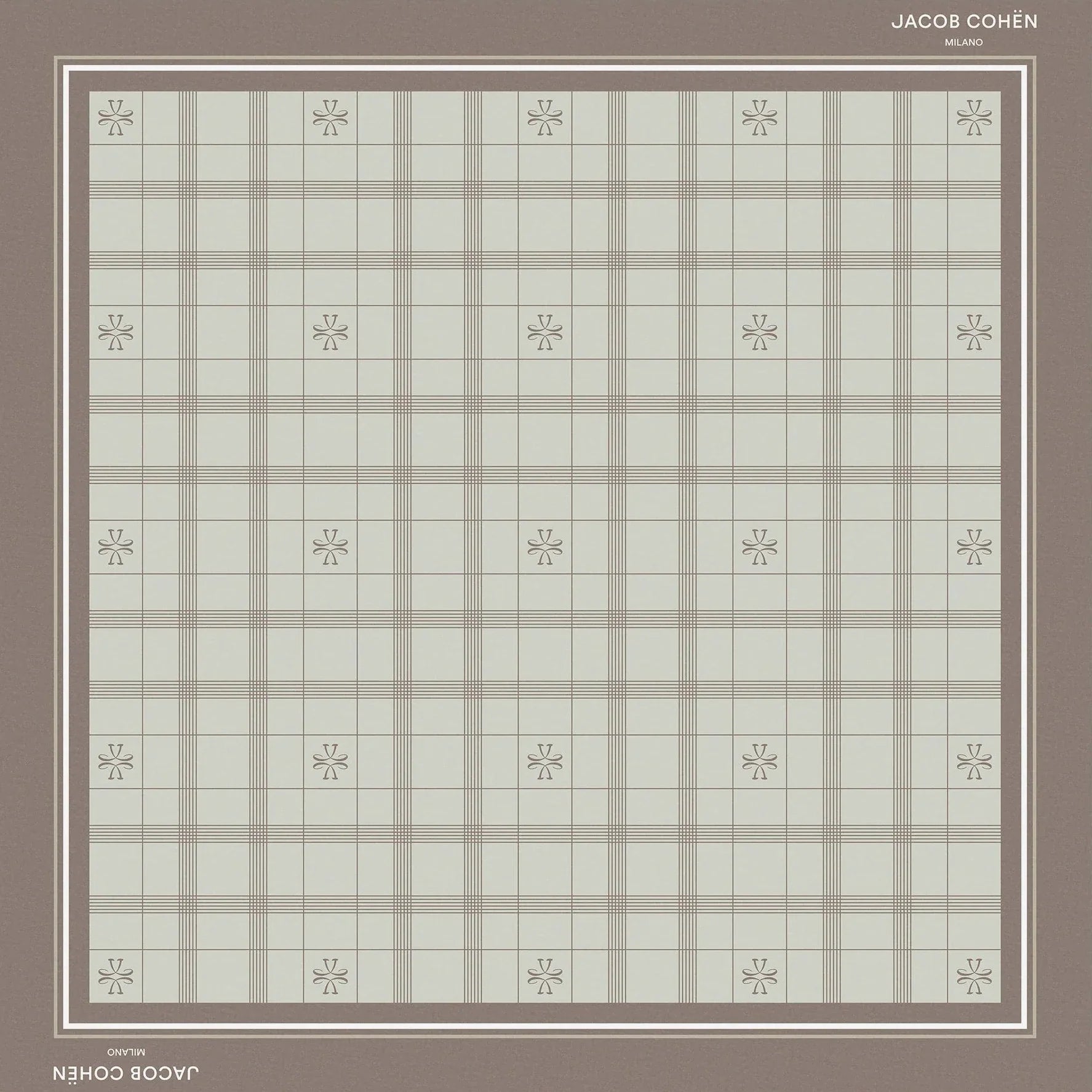 A square bandana shawl with a muted plaid pattern in sage green and taupe, featuring a solid taupe border and small floral motifs at the intersections of the plaid. The brand names 'Jacob Cohën' and 'Milano' are printed on the border.