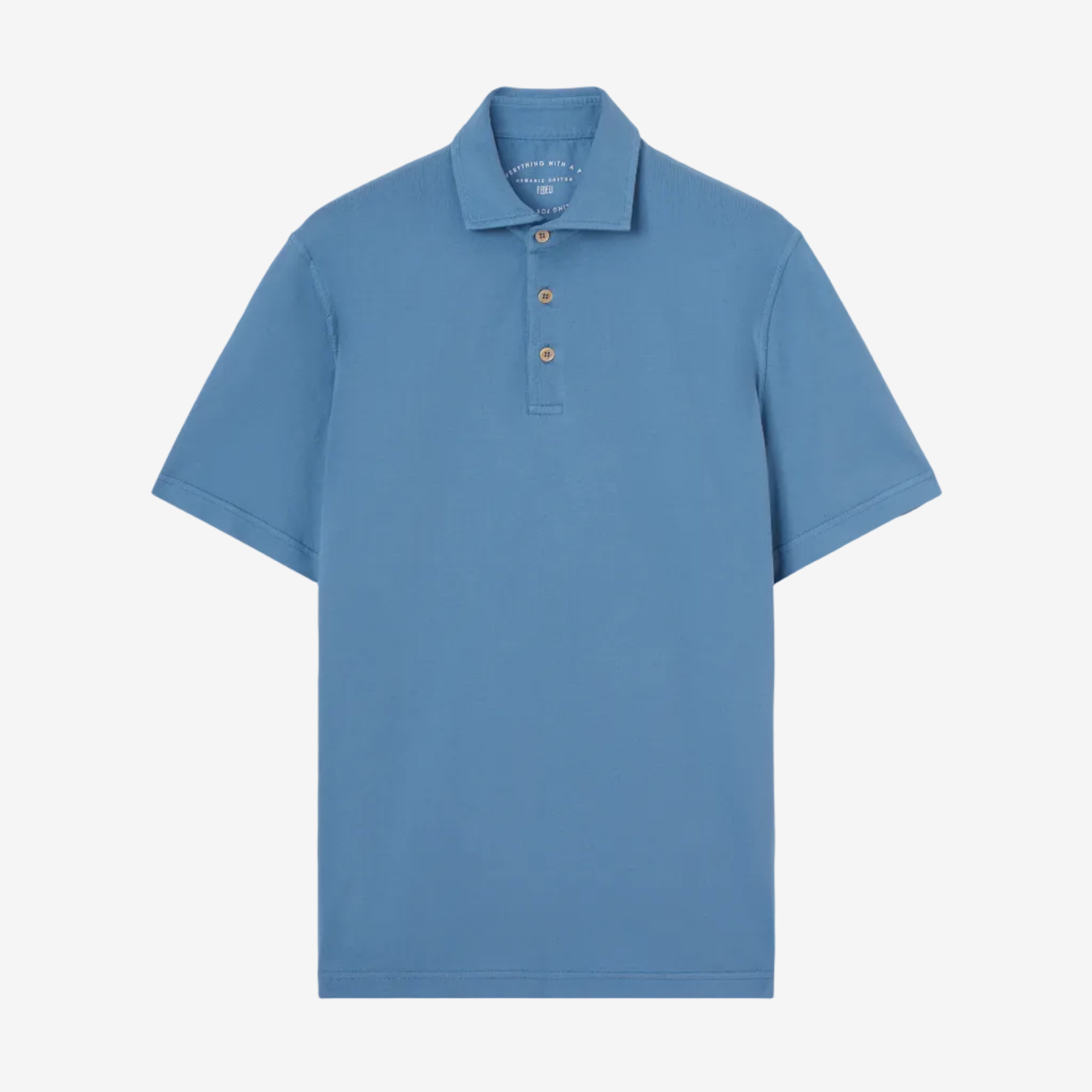Blue polo shirt on a beige background