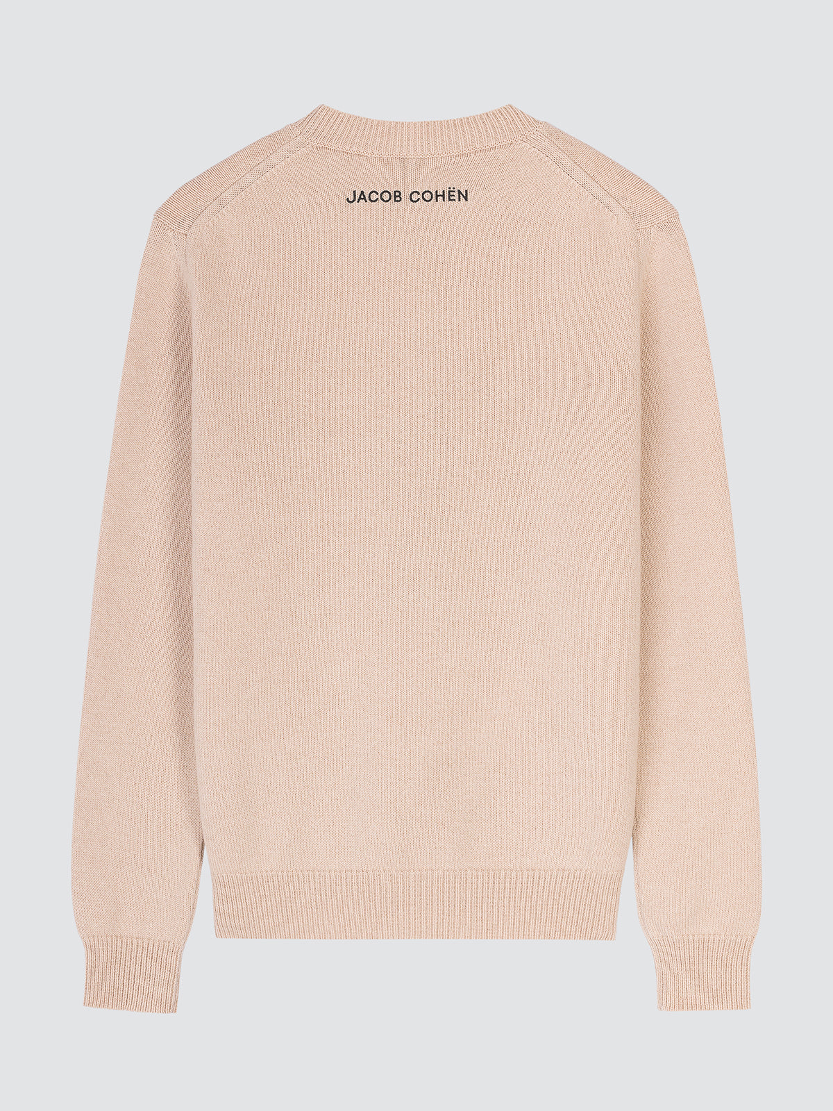 A light beige knit sweater shown from the back, featuring the brand name 'JACOB COHËN' printed in black text at the upper neckline, set against a solid light gray background.