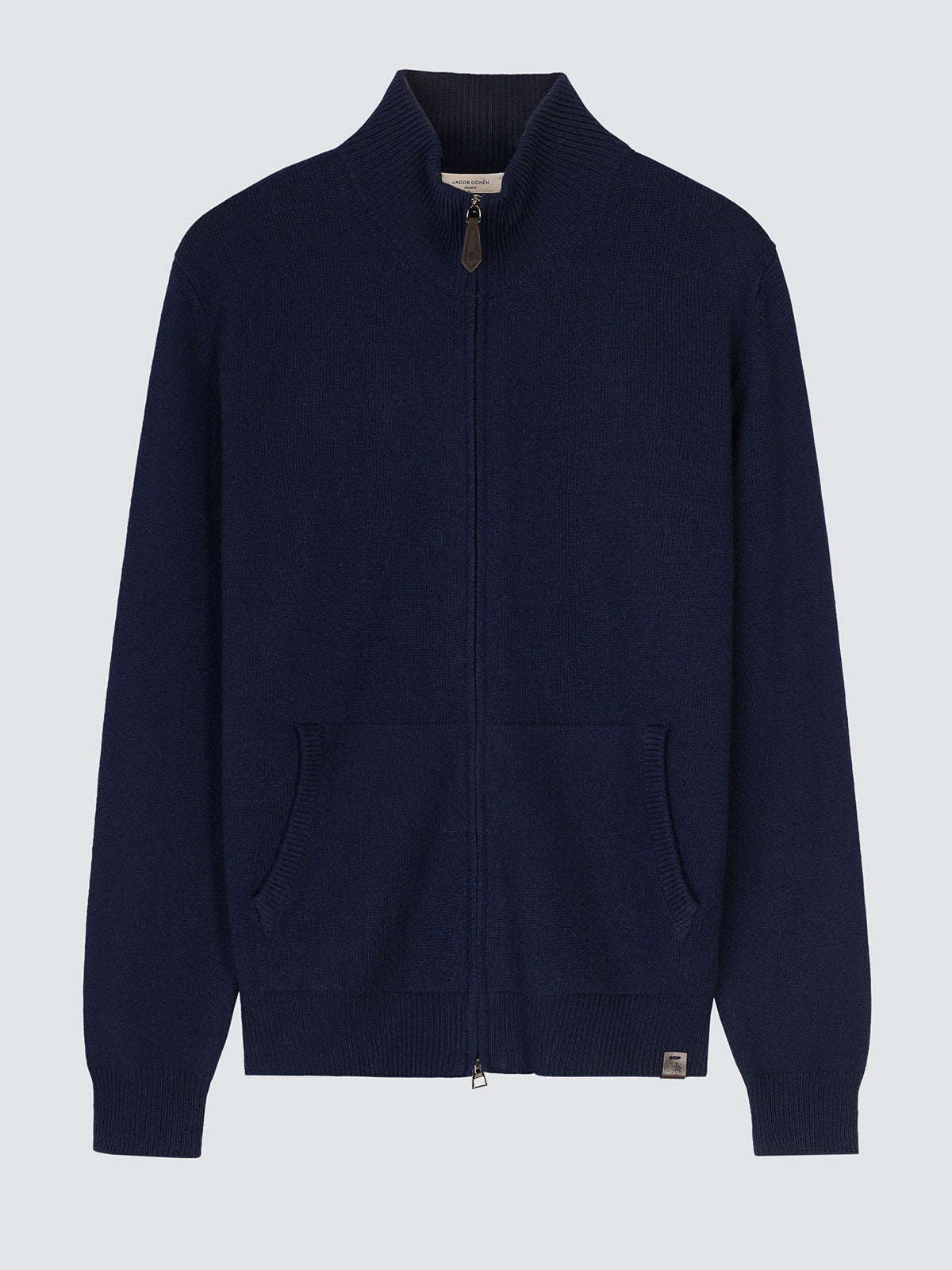 A navy blue knit zip-up sweater with a mock neck collar, front pockets, and ribbed cuffs and hem, shown against a light gray background.