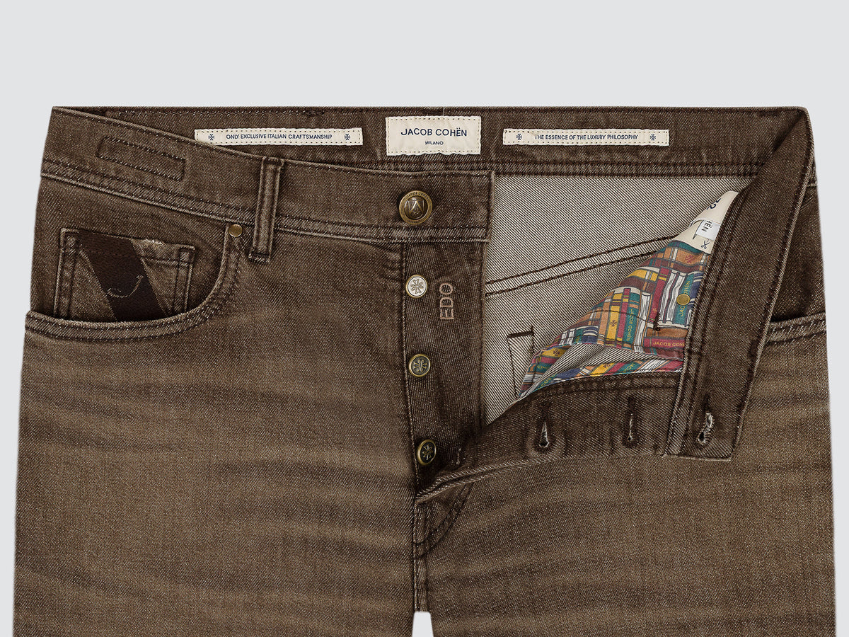 Close-up of the open button fly of the brown Edo jeans, with the Jacob Cohën waistband labels