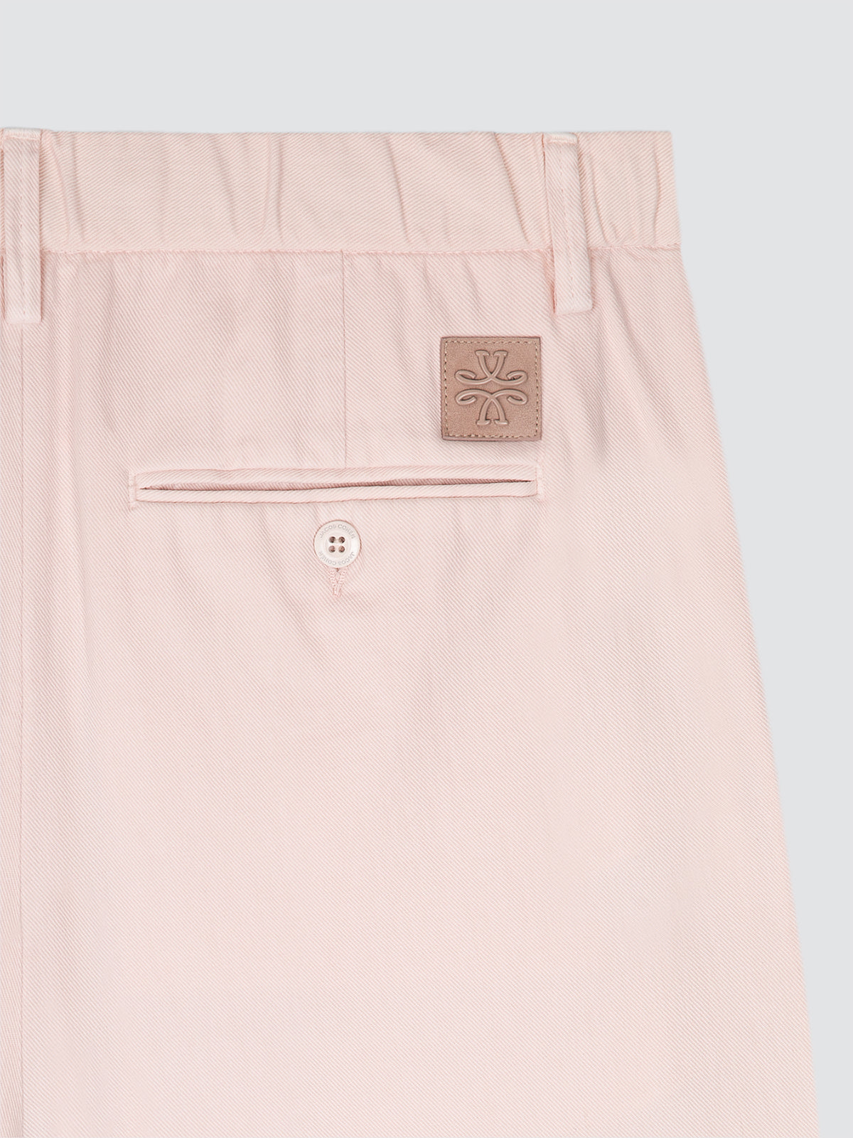 Blush sand short with a brand logo Jacob Cohën  on a light gray background