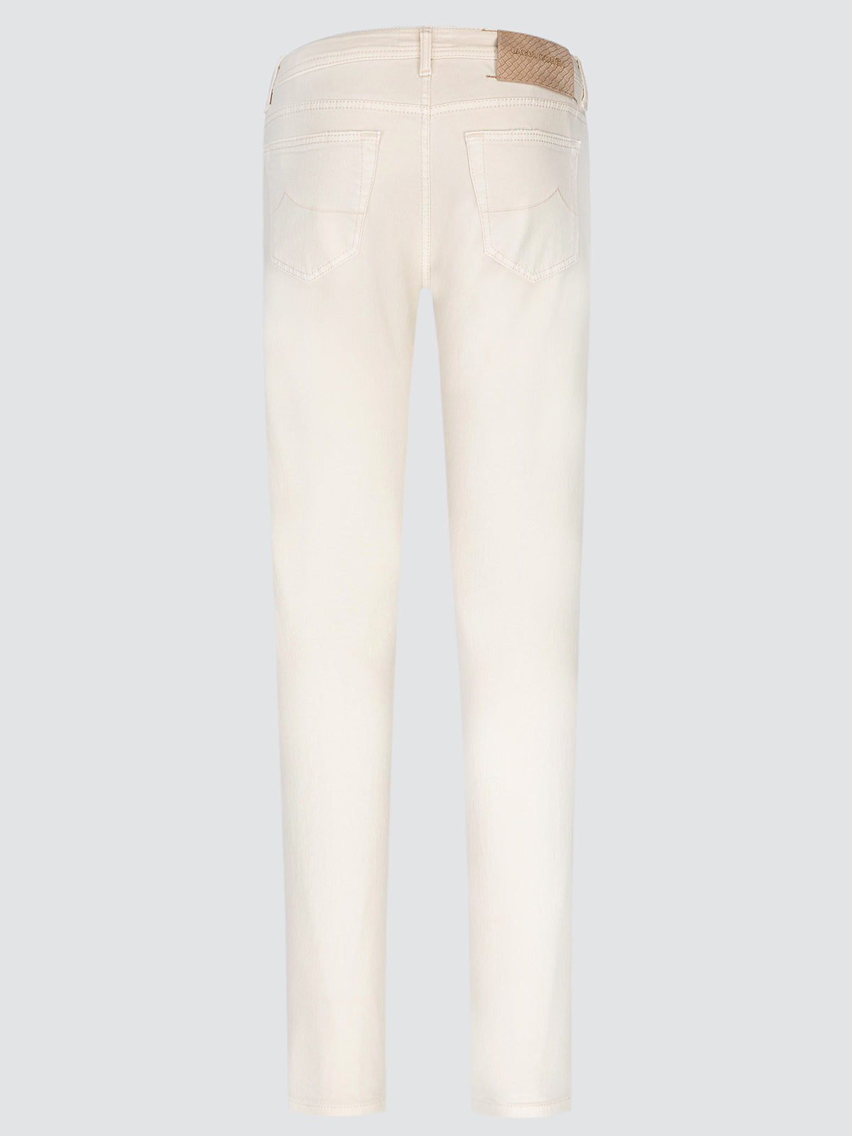 A pair of off-white slim-fit jeans shown from the back, featuring a light brown leather patch on the back waistband, set against a solid light gray background.