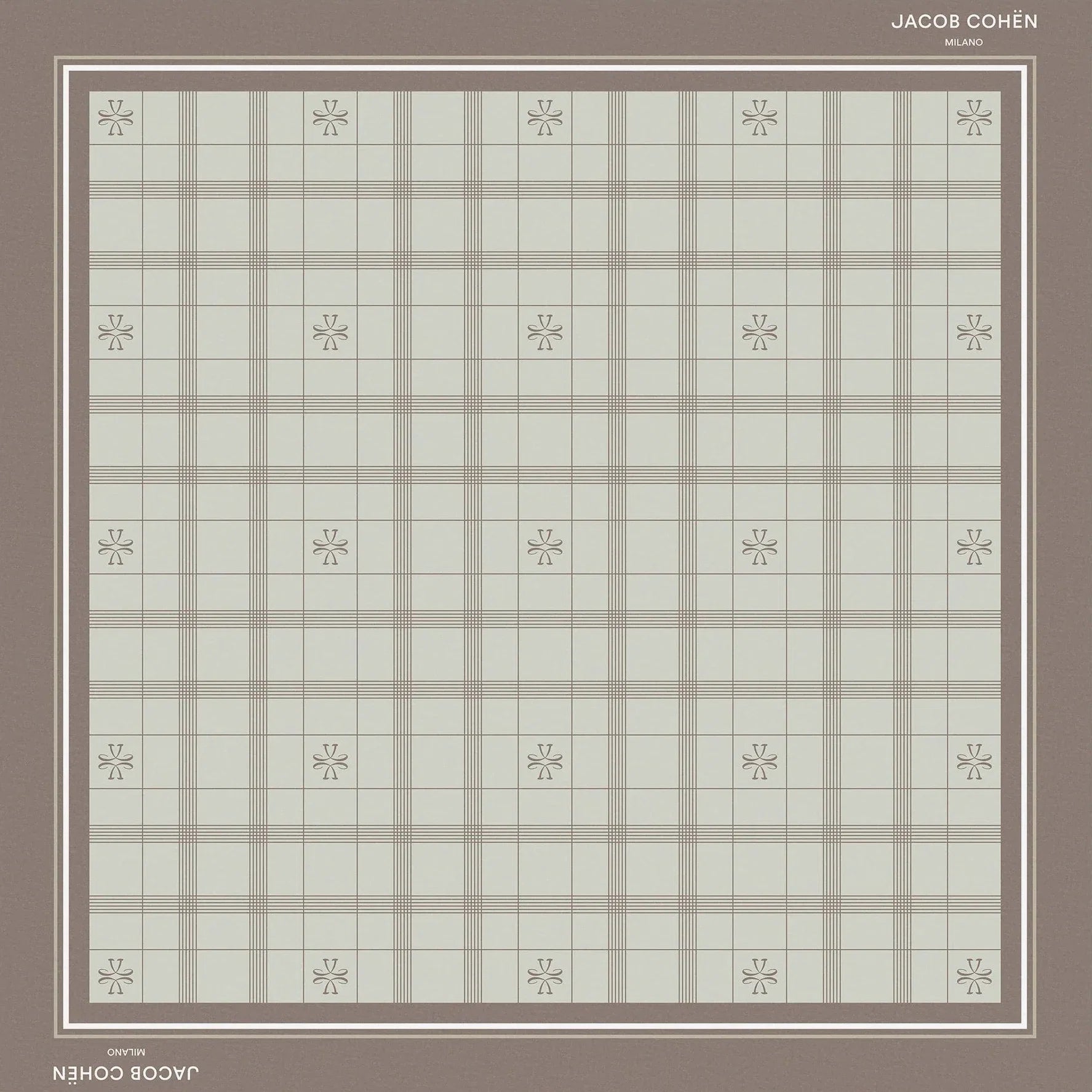 A square bandana shawl with a muted plaid pattern in sage green and taupe, featuring a solid taupe border and small floral motifs at the intersections of the plaid. The brand names 'Jacob Cohën' and 'Milano' are printed on the border.