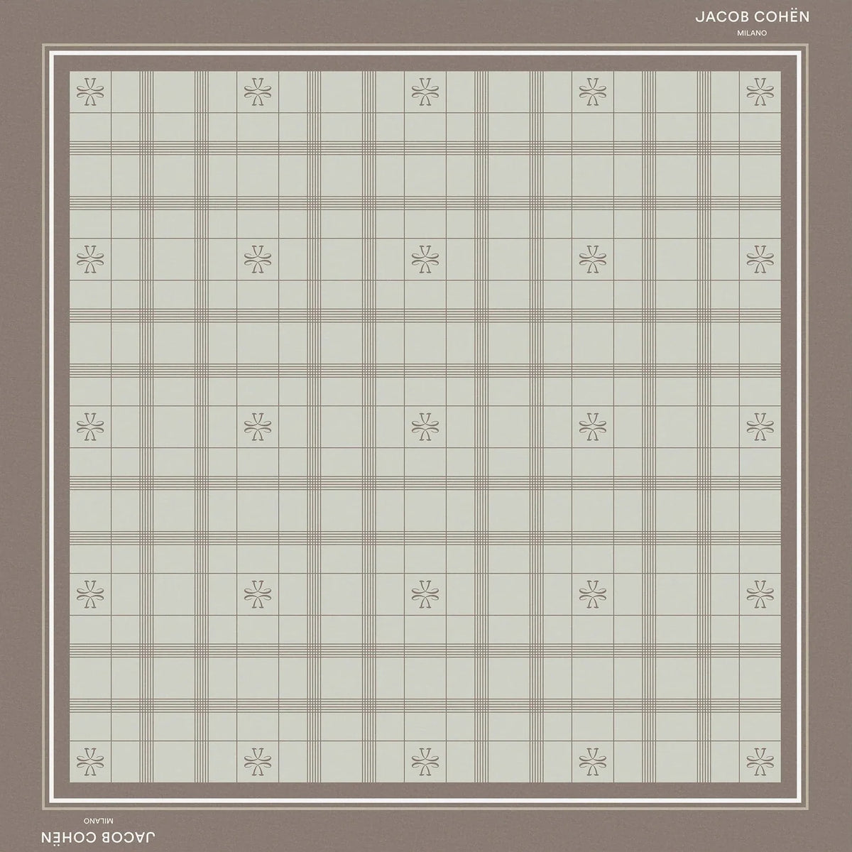 A square bandana shawl with a muted plaid pattern in sage green and taupe, featuring a solid taupe border and small floral motifs at the intersections of the plaid. The brand names 'Jacob Cohën' and 'Milano' are printed on the border.