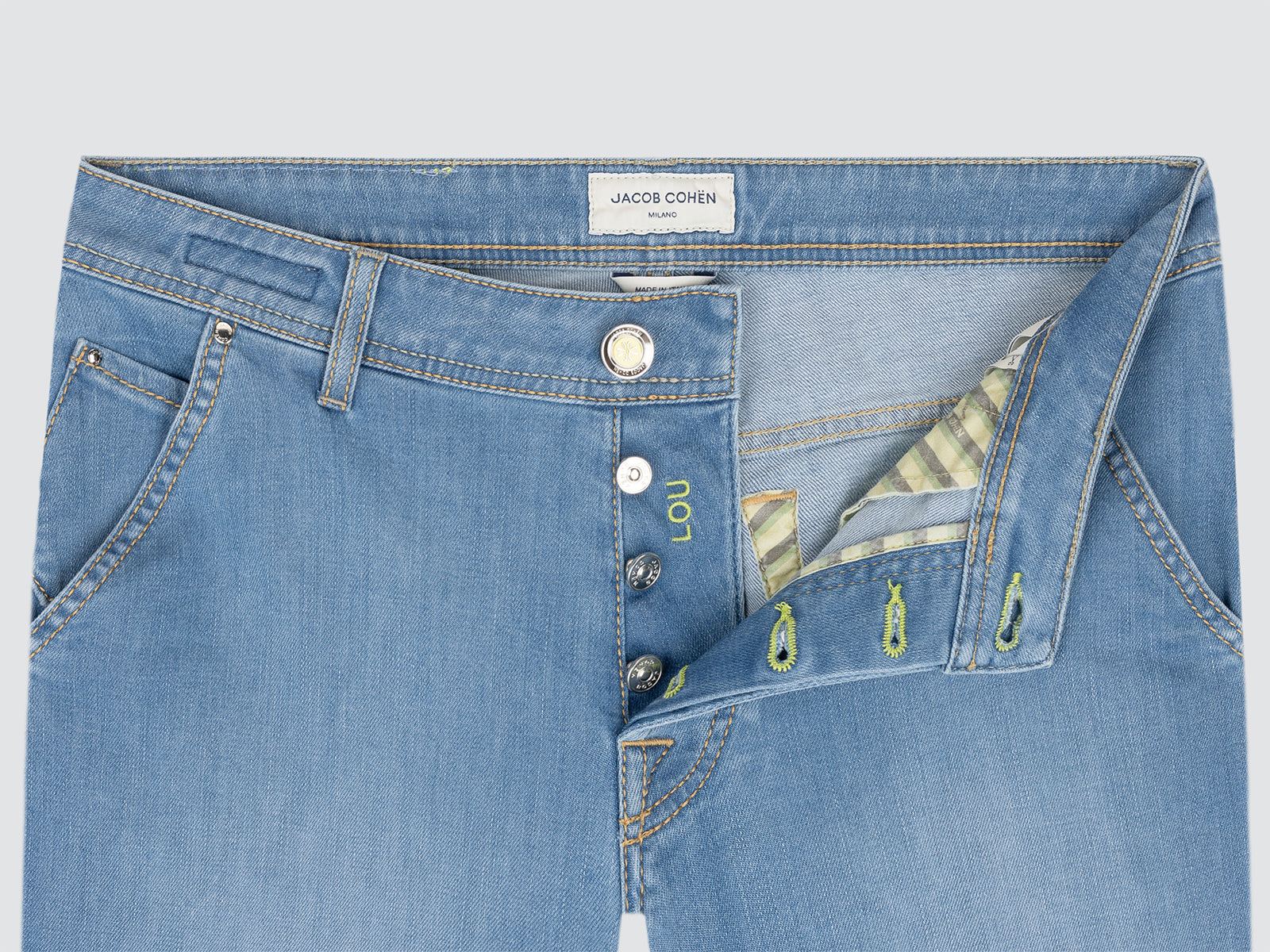 Blue bermuda  jeans with a brand label on a light gray background