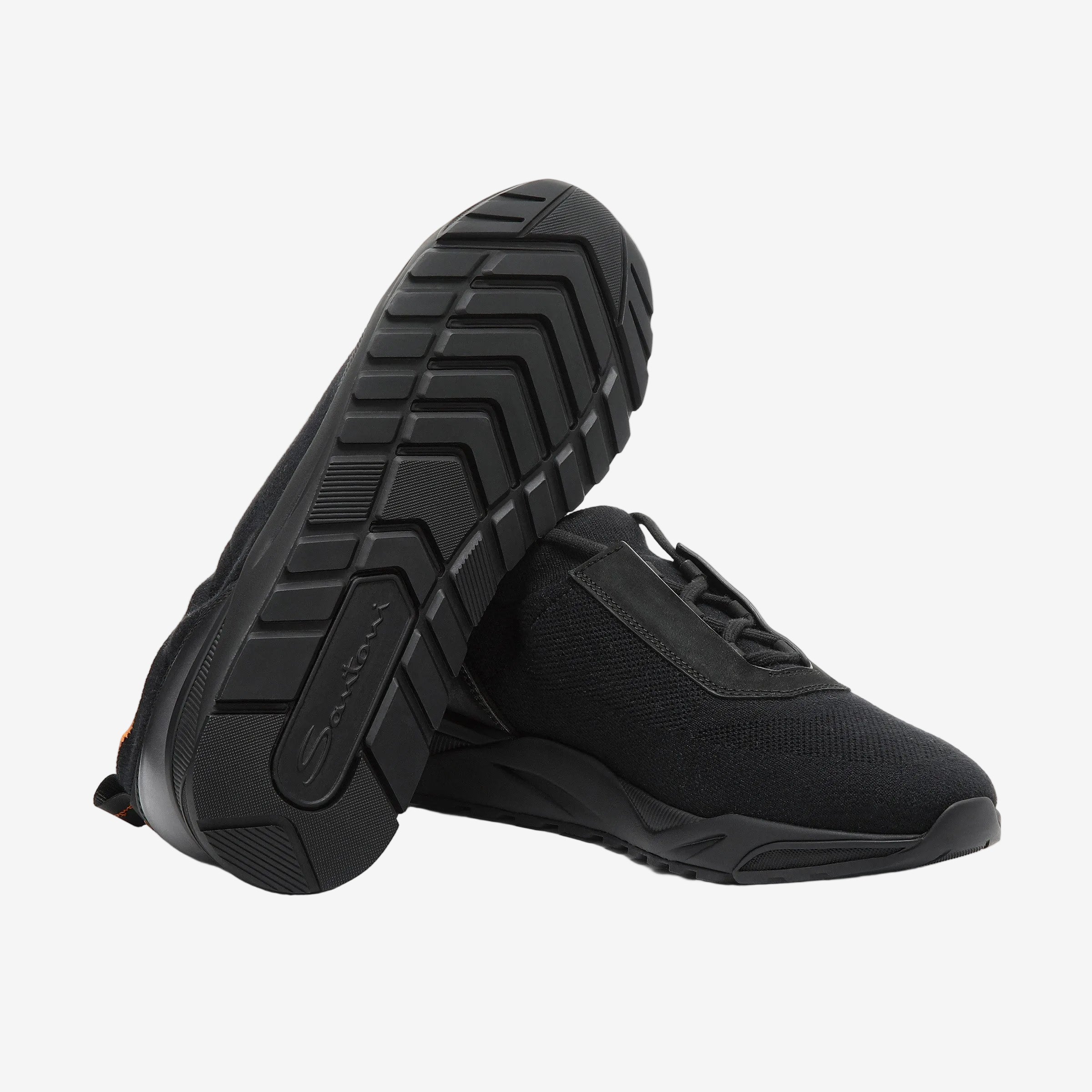 black stretch knit and leather sneaker