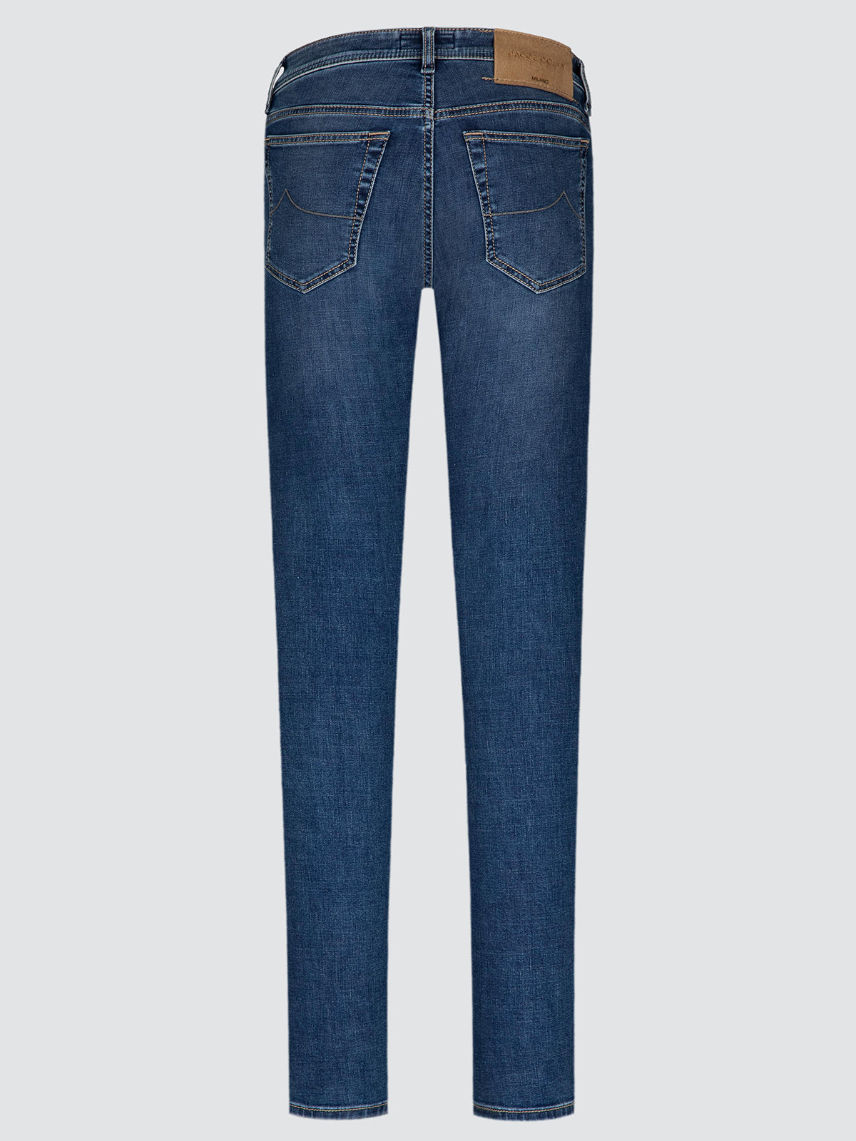 Back view of a pair of medium wash blue denim jeans on a light gray background.