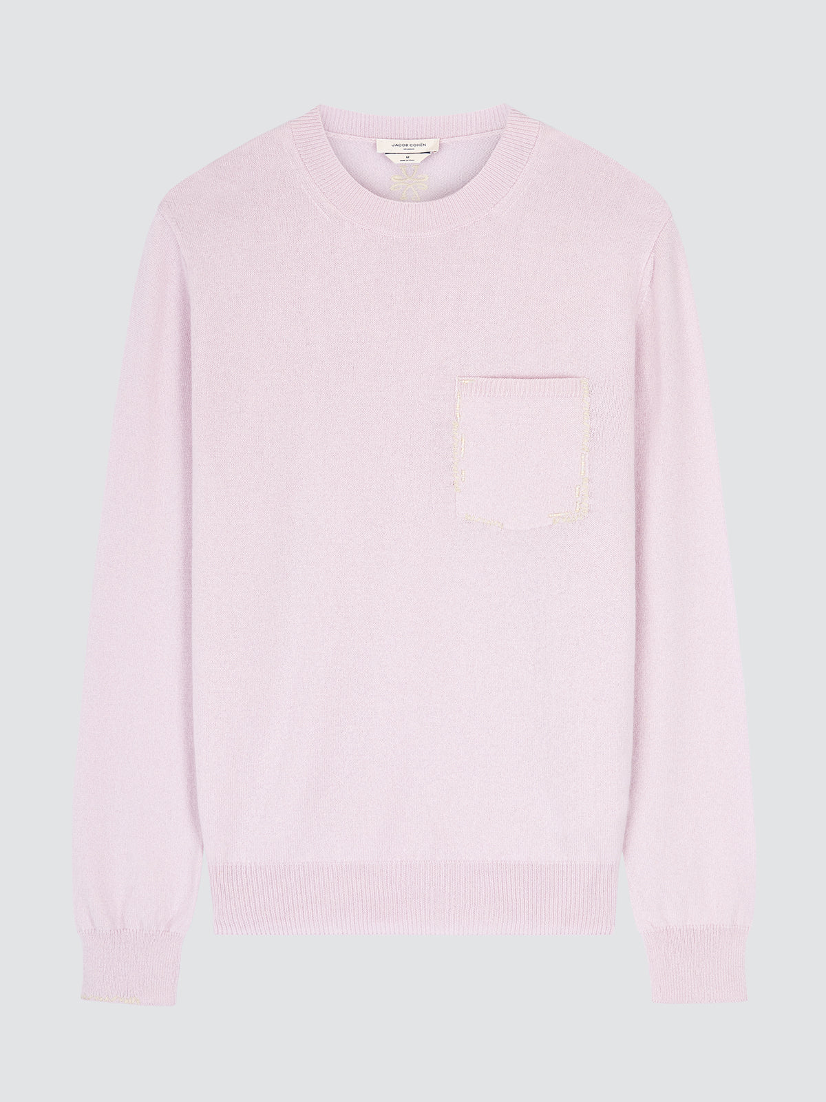Pink sweater on a light gray background