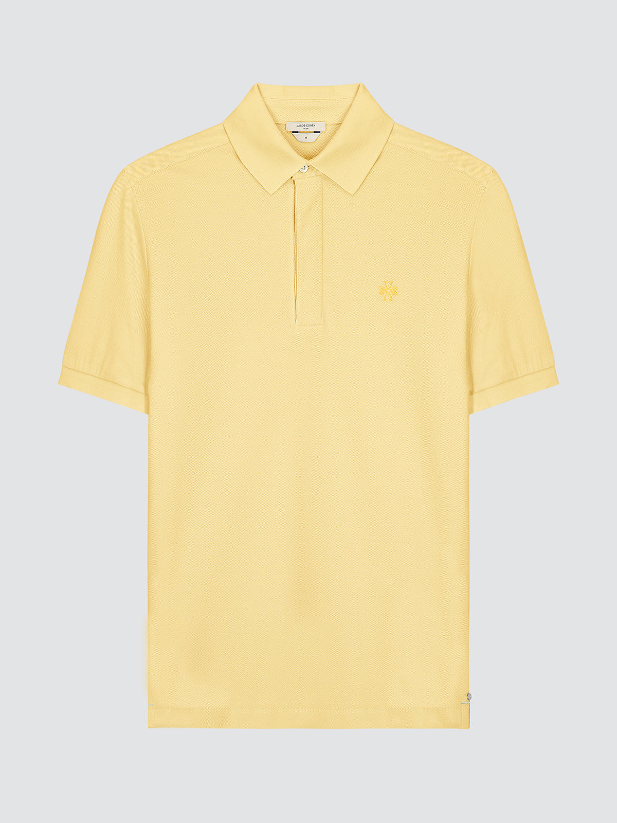 Yellow polo shirt by Jacob Cohen  on a light gray background